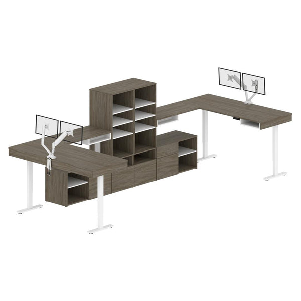 Deux bureaux assis-debout en L 72L avec supports doubles pour moniteurs et rangement